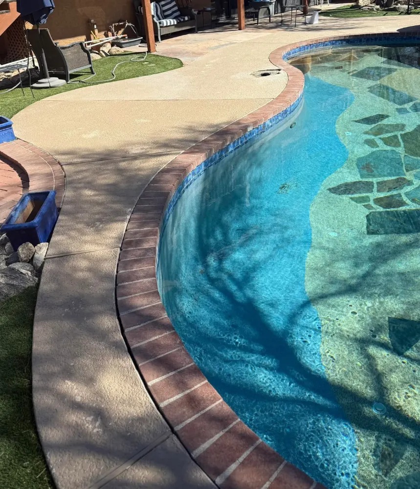Worn pool deck before resurfacing in Tucson